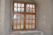 Replika 
okna zápdní fasády. A replica of the window on the western wall.